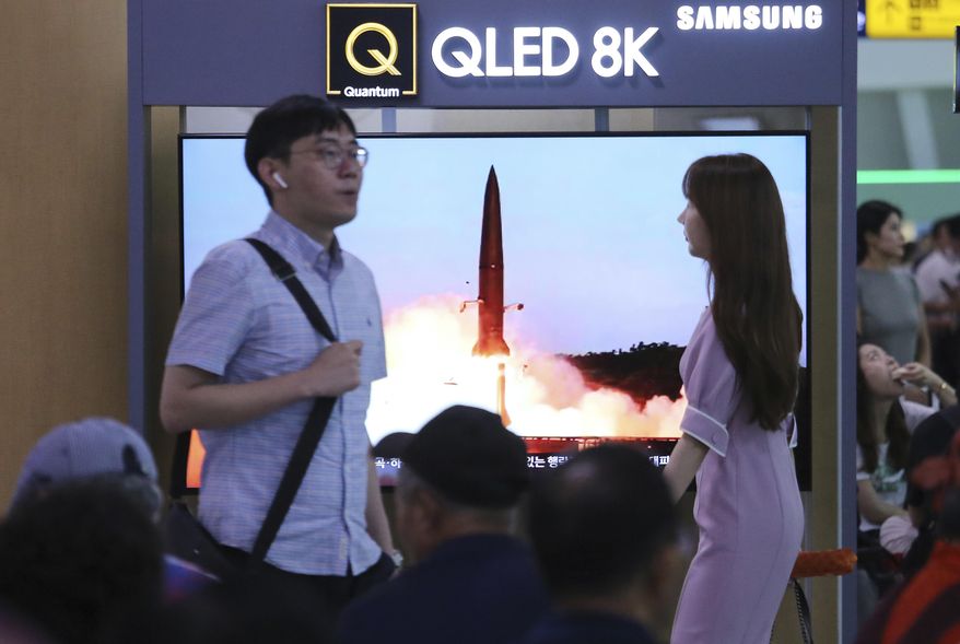 People watch a TV showing an image of North Korea's missile launch during a news program at the Seoul Railway Station in Seoul, South Korea, Friday, July 26, 2019. A day after two North Korean missile launches rattled Asia, the nation said Friday it had tested a "new-type tactical guided weapon" that was meant as a "solemn warning" about South Korean weapons development and its plan to hold military exercises. (AP Photo/Ahn Young-joon)