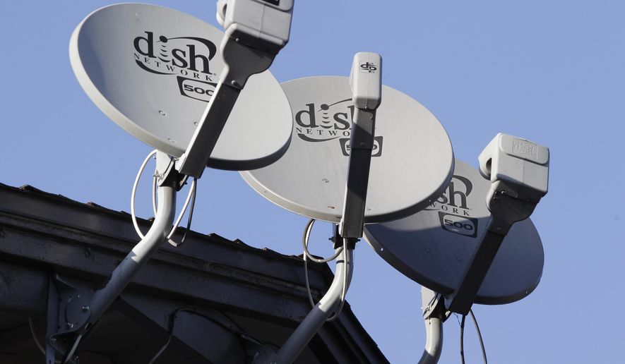 In this Feb. 23, 2011, photo, Dish Network satellite dishes are shown at an apartment complex in Palo Alto, Calif. (AP Photo/Paul Sakuma) **FILE**