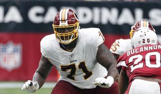 In this Sept. 9, 2018, file photo, Washington Redskins offensive tackle Trent Williams (71) is shown in action during an NFL football game against the Arizona Cardinals, in Glendale, Ariz. Fans worry that the summer rite in the NFL, training camp holdouts, won’t affect their team’s chances for a championship. This year’s crop of no-shows includes an All-Pro receiver, the Saints’ Michael Thomas; a standout offensive tackle who might be the key to the Redskins’ offense, Trent Williams; and budding stars DEs Jadeveon Clowney of the Texans, Yannick Ngakoue of the Jaguars, and RB Melvin Gordon of the Chargers. (AP Photo/Rick Scuteri, File) **FILE**