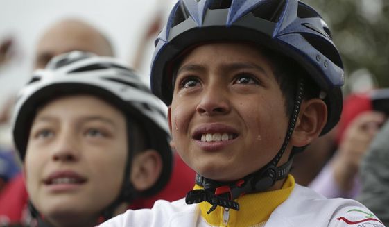 Tears run down the face of a boy watching on a giant screen Colombia&#39;s Egan Bernal performance in the twentieth stage of the Tour de France cycling race Bernal&#39;s hometown in Zipaquira, Colombia, Saturday, July 27, 2019. Bernal put on the overall leader&#39;s yellow jersey after the stage, and barring a crash or a last-minute health issue will become the first Colombian to win the cycling&#39;s biggest race when the Tour ends on Paris&#39; Champs-Elysees on Sunday. (AP Photo/Ivan Valencia)(AP Photo/Ivan Valencia)