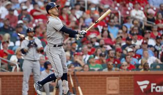 Houston Astros&#39; Carlos Correa watches his grand slam during the third inning of a baseball game against the St. Louis Cardinals, Saturday, July 27, 2019, in St. Louis. (AP Photo/Jeff Roberson)
