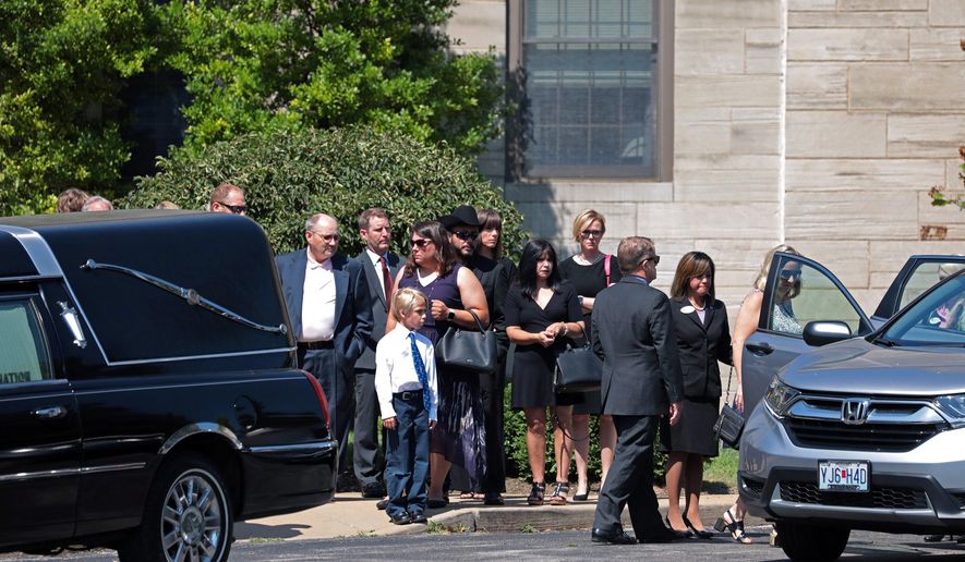 CORRECTS TO SATURDAY, NOT SATURDAY NIGHT - Family and friends depart the the funeral of 21-year-old University of Mississippi student Alexandria "Ally" Kostial at Concordia Lutheran Church in the suburb of Kirkwood, in St. Louis, Mo., on Saturday, July 27, 2019. Kostial was found dead Saturday, July 20, near a lake about 30 miles (50 kilometers) from the university's Oxford, Miss., campus. Another Ole Miss student, 22-year-old Brandon Theesfeld, is charged with murder. (Cristina M. Fletes/St. Louis Post-Dispatch via AP)