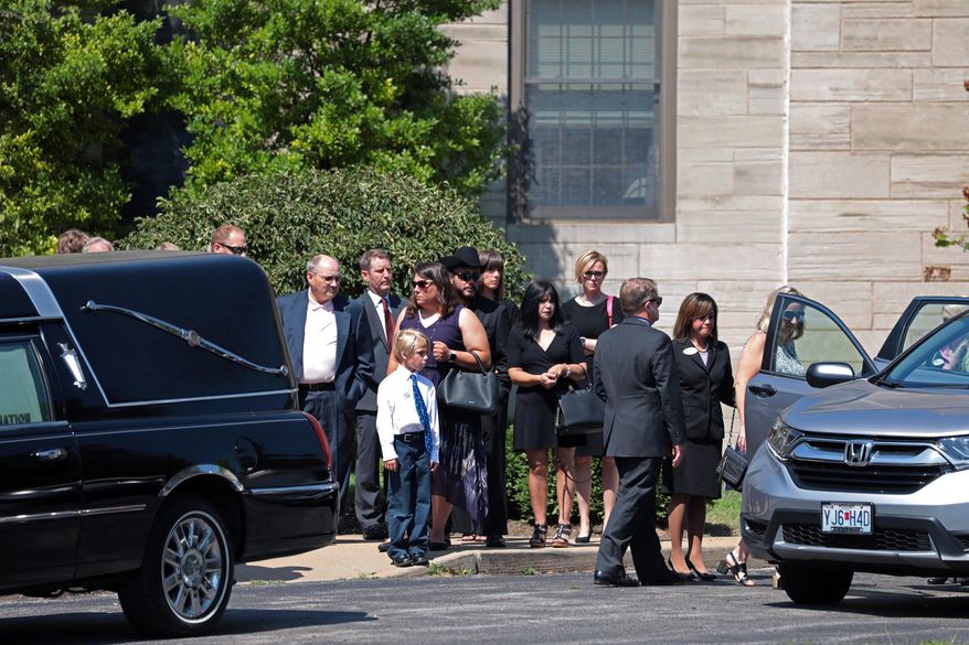 CORRECTS TO SATURDAY, NOT SATURDAY NIGHT - Family and friends depart the the funeral of 21-year-old University of Mississippi student Alexandria "Ally" Kostial at Concordia Lutheran Church in the suburb of Kirkwood, in St. Louis, Mo., on Saturday, July 27, 2019. Kostial was found dead Saturday, July 20, near a lake about 30 miles (50 kilometers) from the university's Oxford, Miss., campus. Another Ole Miss student, 22-year-old Brandon Theesfeld, is charged with murder. (Cristina M. Fletes/St. Louis Post-Dispatch via AP)