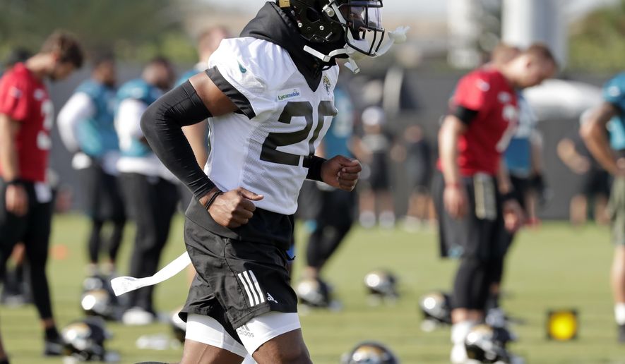 Jacksonville Jaguars cornerback Jalen Ramsey (20) warms up during an NFL football practice at the teams training facility, Friday, July 26, 2019, in Jacksonville, Fla. (AP Photo/John Raoux)