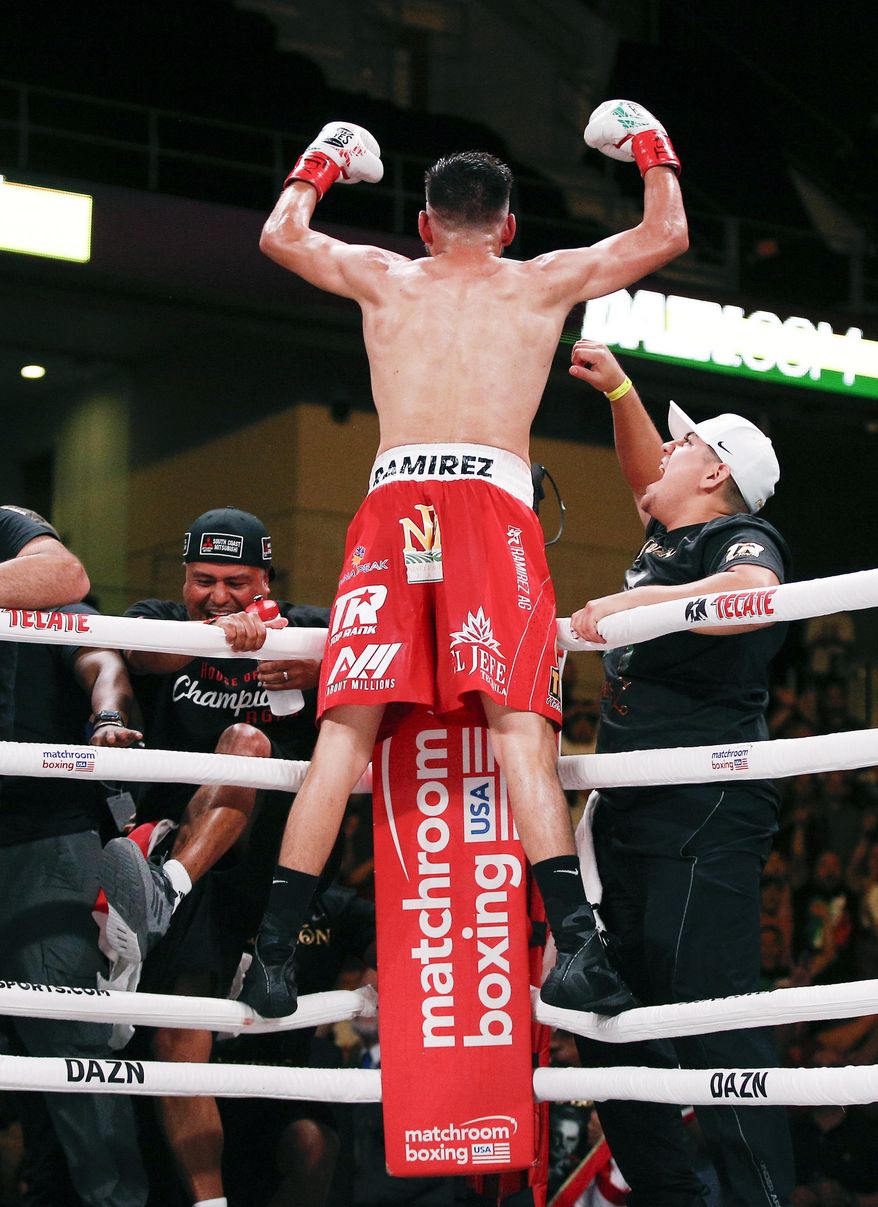 Jose Ramirez celebrates a TKO against Maurice Hooker after six rounds of a boxing match, Saturday, July 27, 2019, in Arlington, Texas. (AP Photo/Brandon Wade)