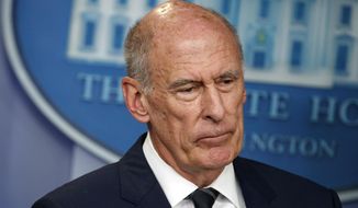 FILE - In this Aug. 2, 2018, file photo, Director of National Intelligence Dan Coats listens during a daily press briefing at the White House in Washington. Coats is to resign in days, after a two-year tenure marked by President Donald Trump&#39;s clashes with intelligence officials, U.S. officials said on Sunday, July 28, 2019. (AP Photo/Evan Vucci, FIle)