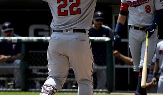 Minnesota Twins Miguel Sano (22) reacts after he hit a three-run home run during the first inning of a baseball game against the Chicago White Sox, Sunday, July 28, 2019, in Chicago. (AP Photo/Matt Marton)