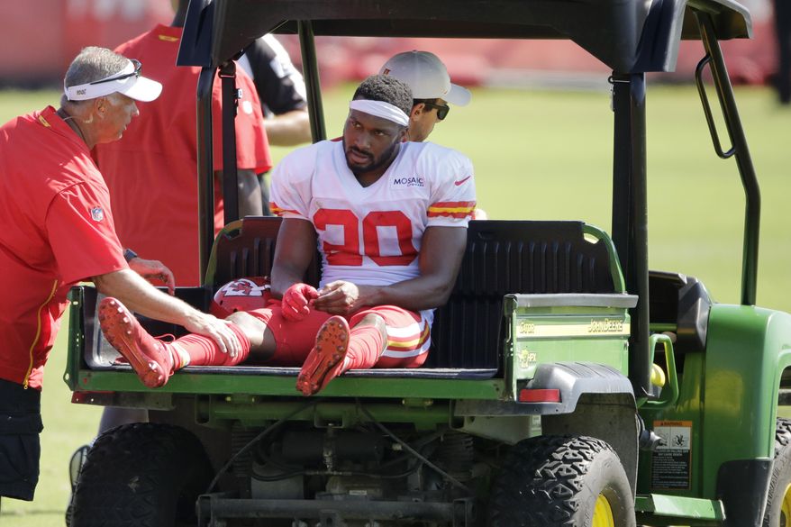Kansas City Chiefs cornerback Keith Reaser (20) is carted off the field after being injured during NFL football training camp Monday, July 29, 2019, in St. Joseph, Mo. (AP Photo/Charlie Riedel)