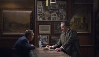 This image released by Netflix shows Joe Pesci, left, and Robert De Niro in a scene from &amp;quot;The Irishman.&amp;quot; The film will make its world premiere at opening night of the New York Film Festival on  September 27. (Niko Tavernise/Netflix via AP)