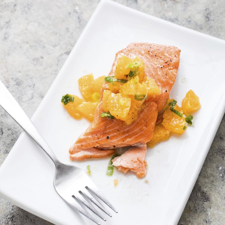 This undated photo provided by America's Test Kitchen in July 2019 shows Oven-Roasted Salmon with Relish in Brookline, Mass. This recipe appears in the cookbook “Nutritious Delicious.” (Daniel J. van Ackere/America's Test Kitchen via AP)