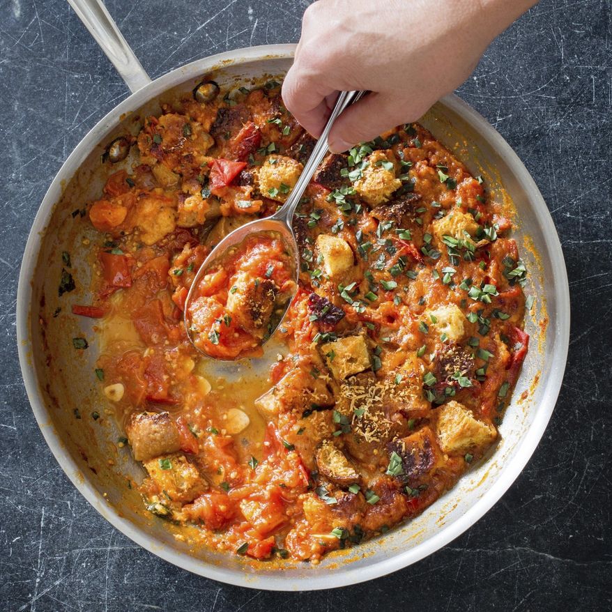 This undated photo provided by America's Test Kitchen in July 2019 shows Summer Tomato Gratin in Brookline, Mass. This recipe appears in the cookbook "Vegetables Illustrated." (Carl Tremblay/America's Test Kitchen via AP)