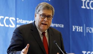 In this July 23, 2019, file photo U.S. Attorney General William Barr addresses the International Conference on Cyber Security at Fordham University in New York. (AP Photo/Richard Drew, File)