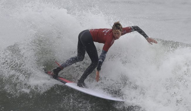 Kevin Schulz of the United States competes in the men&#x27;s open surfing main round 1, during the Pan American Games on Punta Rocas beach in Lima Peru, Monday, July 29, 2019. (AP Photo/Silvia Izquierdo)
