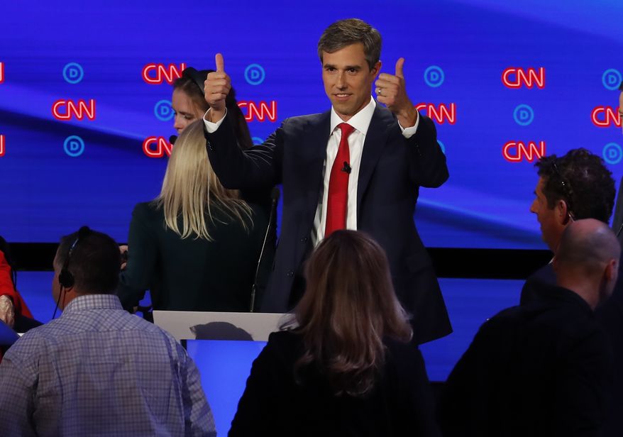 Former Texas Rep. Beto O'Rourke gives a thumbs up during a break in the first of two Democratic presidential primary debates hosted by CNN Tuesday, July 30, 2019, in the Fox Theatre in Detroit. (AP Photo/Paul Sancya)