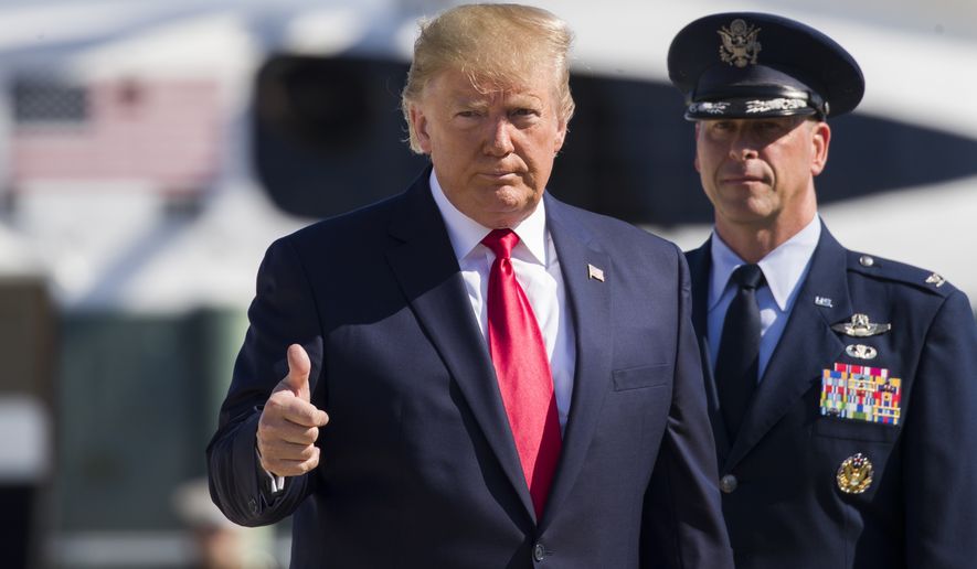President Donald Trump gives thumbs up as walks to Air Force One as he departs Tuesday, July 30, 2019, at Andrews Air Force Base, Md. (AP Photo/Alex Brandon)