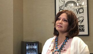 Pamela Foster speaks to reporters on Tuesday, July 30, 2019, at Isleta Pueblo, N.M., where a training session is being held for tribes to implement their own Amber Alert systems. Foster&#x27;s daughter Ashlynne Mike was 11 when she was kidnapped and killed in May 2016 after school near her home on the Navajo Nation. An Amber Alert wasn&#x27;t issued for her until early the next morning. (AP Photo/Mary Hudetz)