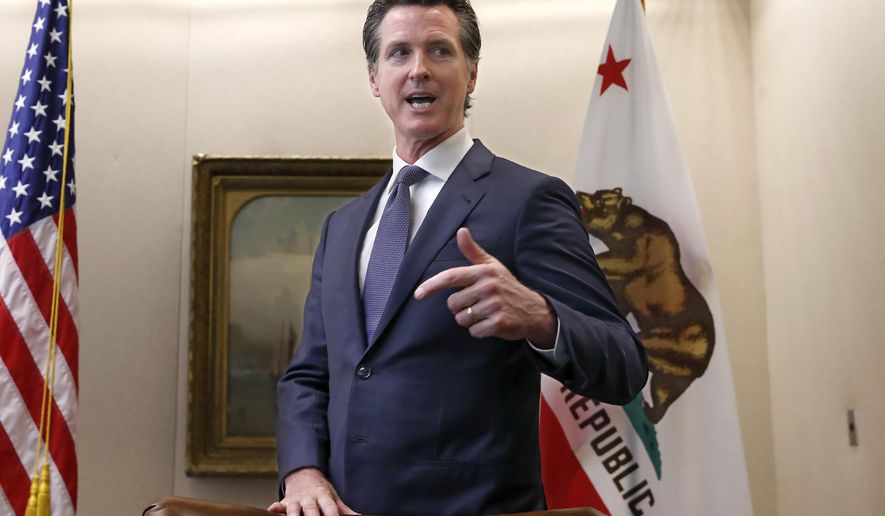 FILE - In this July 11, 2019 file photo, California Gov. Gavin Newsom talks with reporter's at his office in Sacramento, Calif. Legislation to allow all Californians to register as domestic partners instead of marrying was signed into law by Gov. Newsom Tuesday, July 30, 2019. (AP Photo/Rich Pedroncelli, File )