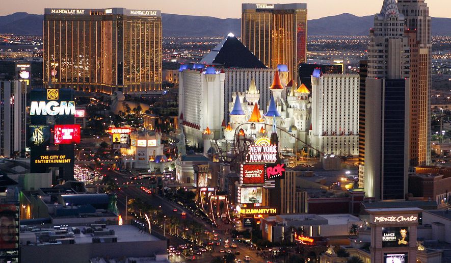 FILE - This Oct. 20, 2009 file photo shows casinos on the Las Vegas Strip. A jump in winnings by casinos in Nevada in June helped push statewide fiscal year gambling figures up a tick, to more than $11.9 billion for the 12 months ending June 30, 2019. (AP Photo/Isaac Brekken, File)