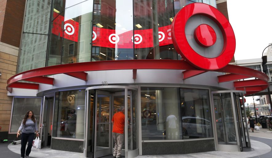 FILE - In this July 10, 2019, file photo shoppers visit the downtown Target Store in Minneapolis. On Tuesday, July 30, the government reports on the pace of consumer spending in June. (AP Photo/Jim Mone, File)
