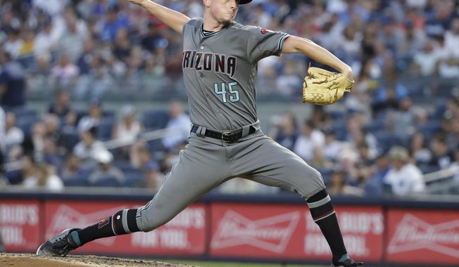 Arizona Diamondbacks&#x27; Taylor Clarke delivers a pitch during the third inning of the team&#x27;s baseball game against the New York Yankees on Tuesday, July 30, 2019, in New York. (AP Photo/Frank Franklin II)