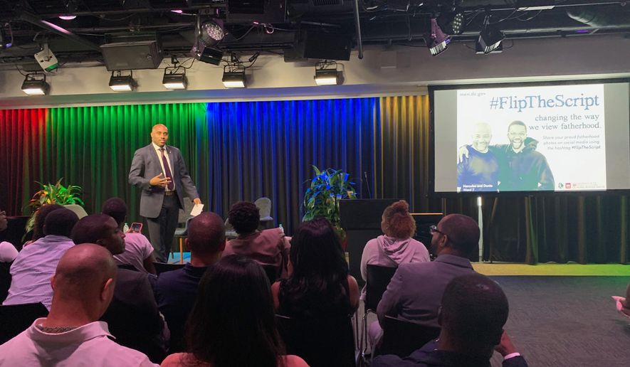 Jason Wallace, director of the D.C. Mayor’s Office of Father’s, Men and Boys, introduces a campaign to counter the negative images of men of color in the media at the Google office in Washington, D.C., on Monday. (Sophie Kaplan / The Washington Times)