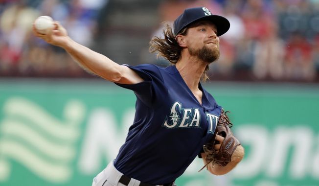 Seattle Mariners starting pitcher Mike Leake throws to the Texas Rangers in the first inning of a baseball game in Arlington, Texas, Tuesday, July 30, 2019. (AP Photo/Tony Gutierrez)