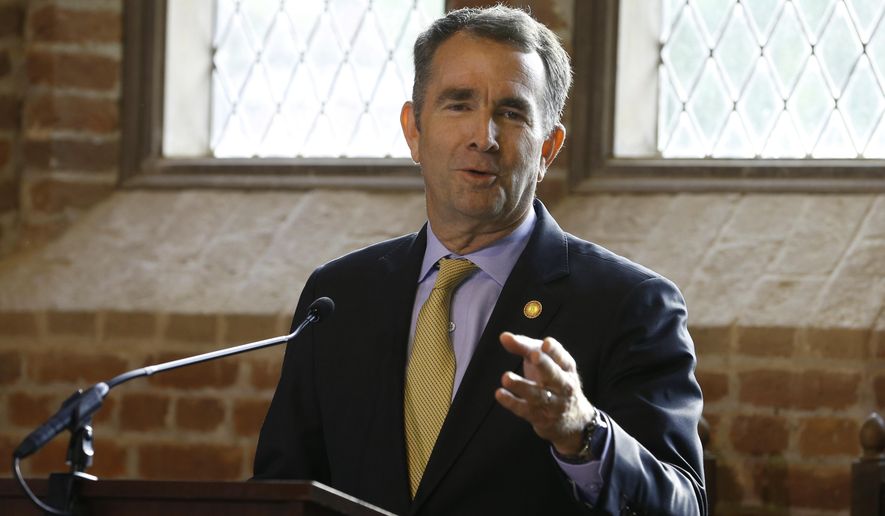 Virginia Gov. Ralph Northam addresses a commemorative meeting of the Virginia General Assembly on the 400th anniversary of the first House of Burgess meeting at a church in Historic Jamestown, Va., on the site where the meeting took place, Tuesday, July 30, 2019. (AP Photo/Steve Helber) ** FILE **