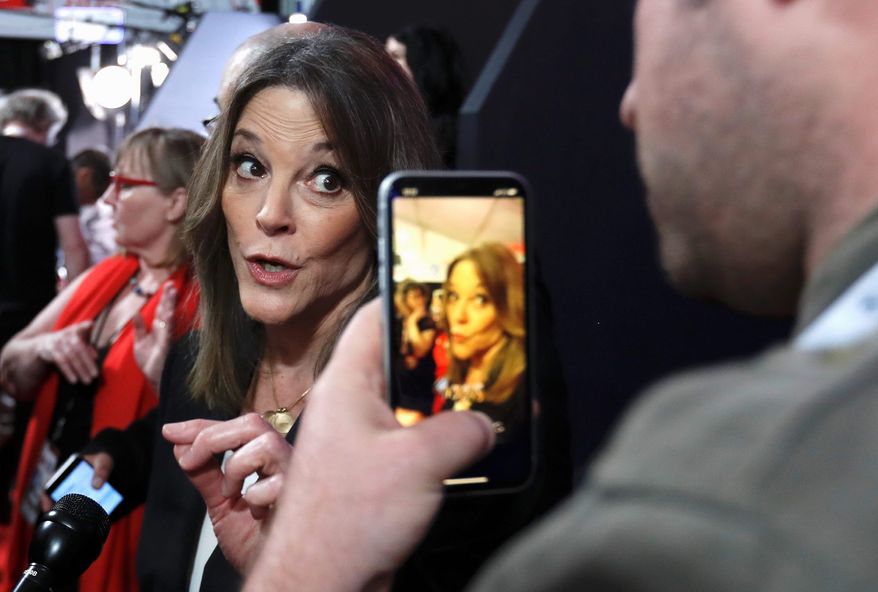 Marianne Williamson, called a new leader for the "religious left," pauses to talk to reporters following a debate in Detroit. (Associated Press)