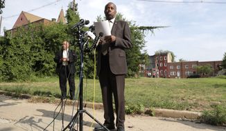 Housing and Urban Development Secretary Ben Carson speaks during a news conference after touring the Hollins House, a high rise building housing seniors and persons with disabilities, during a trip to Baltimore, Wednesday, July 31, 2019. Carson highlighted the Hollins House, which has 130 one-bedroom units, as an opportunity zone where encourage investment and development in distressed communities. (AP Photo/Julio Cortez)