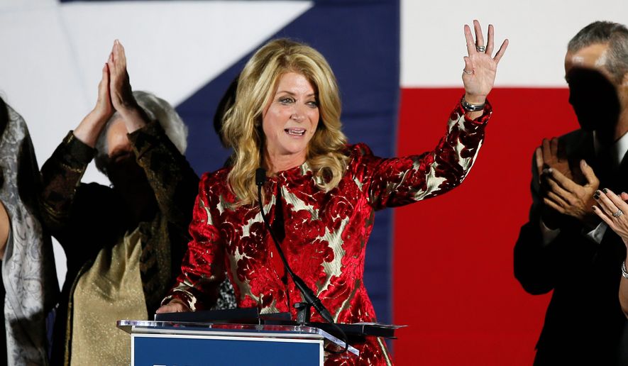 In this file photo, then-Texas Democratic gubernatorial candidate Wendy Davis waves to supporters after making her concession speech in Fort Worth, Texas. Ms. Davis is running for a U.S. House seat in 2020. (AP Photo/Tony Gutierrez, File)