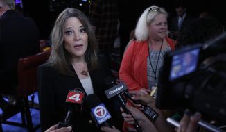 Marianne Williamson talks to reporters after the first of two Democratic presidential primary debates hosted by CNN Tuesday, July 30, 2019, in the Fox Theatre in Detroit. (AP Photo/Carlos Osorio)