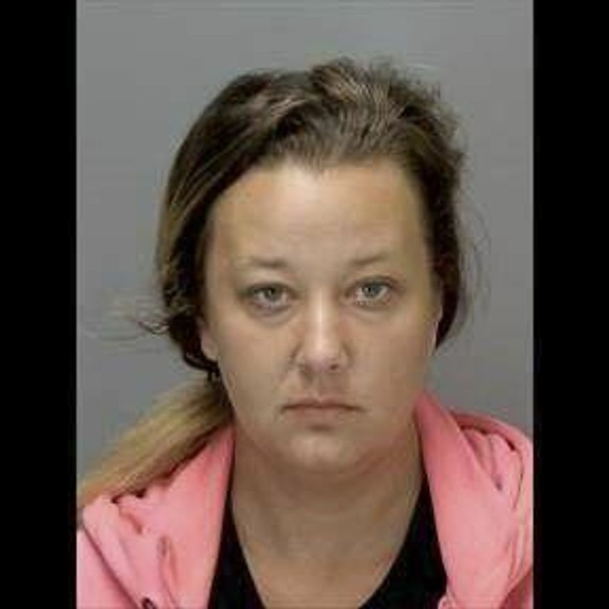 FILE--In this undated booking file photo released by the Ingham County Jail shows Sarah Conde. Conde, 29, is one of two Michigan parents accused of child abuse has been sentenced to 3-10 years in prison. The Lansing State Journal reports Conde learned her punishment Wednesday, July 31, 2019 after earlier pleading guilty to child abuse. She apologized, saying: "I do acknowledge that I did fail as a parent." The abuse was discovered in 2017 in Lansing.(Ingham County Jail via AP, File)