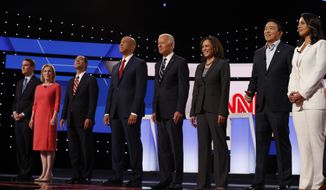 From left, Sen. Michael Bennet, D-Colo., Sen. Kirsten Gillibrand, D-N.Y., former HUD Secretary Julian Castro, Sen. Cory Booker, D-N.J., former Vice President Joe Biden, Sen. Kamala Harris, D-Calif., Andrew Yang and Rep. Tulsi Gabbard, D-Hawaii, are introduced before the second of two Democratic presidential primary debates hosted by CNN Wednesday, July 31, 2019, in the Fox Theatre in Detroit. (AP Photo/Carlos Osorio)