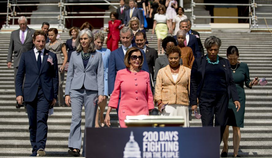 In this July 25, 2019, photo, House Speaker Nancy Pelosi of Calif., and House Democrats arrive for a news conference on the first 200 days of the 116th Congress at the House East Front steps of the Capitol in Washington. (AP Photo/Andrew Harnik) **FILE**