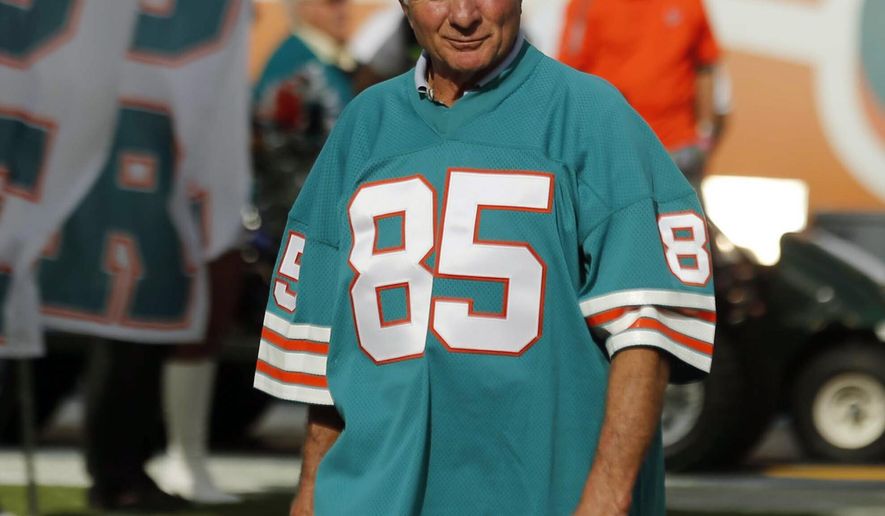 FILE - In this Dec. 16, 2012, file photo, Nick Buoniconti, former Miami Dolphins player and member of the 1972 undefeated team, in introduced during the half time show of an NFL football game against the Jacksonville Jaguars, in Miami. Pro Football Hall of Fame middle linebacker Nick Buoniconti, an undersized overachiever who helped lead the Miami Dolphins to the NFL's only perfect season, has died at the age of 78. Bruce Bobbins, a spokesman for the Buoniconti family, said he died Tuesday, July 30, 2019, in Bridgehampton, N.Y. (AP Photo/John Bazemore, FIle)