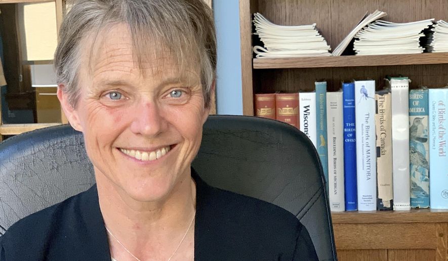 The Right Rev. Mariann Edgar Budde poses for a photo on Tuesday, July 30, 2019, at her home in Minneapolis. Budde is bishop of the Episcopal Diocese of Washington, and is among faith leaders at Washington National Cathedral who responded to President Donald Trump’s derogatory comments about Baltimore. (AP Photo/Jeff Baenen)