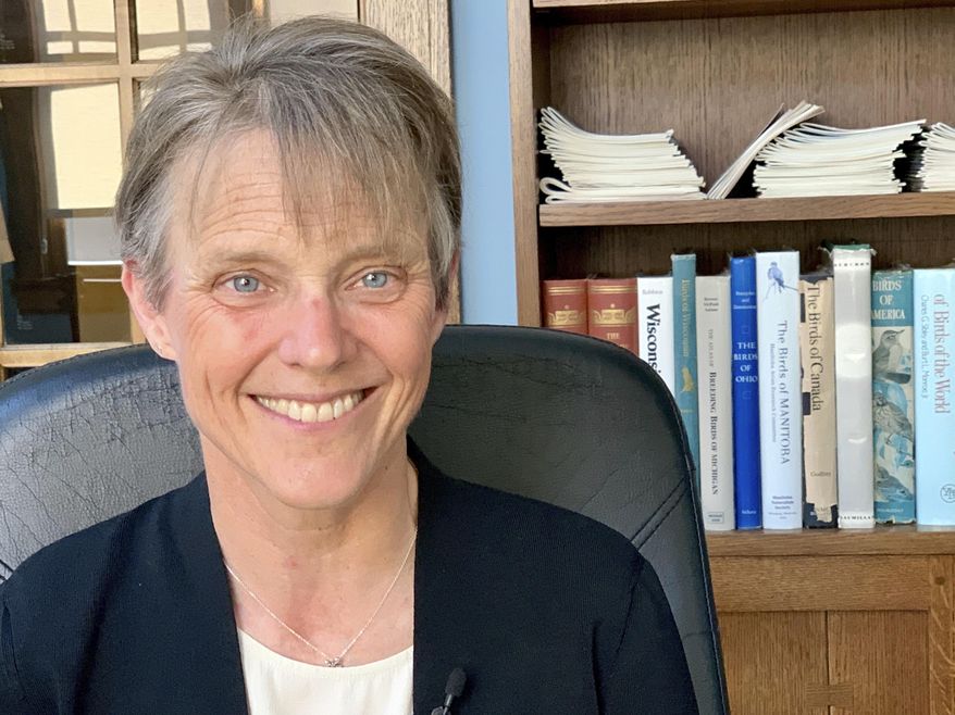 The Right Rev. Mariann Edgar Budde poses for a photo on Tuesday, July 30, 2019, at her home in Minneapolis. Budde is bishop of the Episcopal Diocese of Washington, and is among faith leaders at Washington National Cathedral who responded to President Donald Trump’s derogatory comments about Baltimore. (AP Photo/Jeff Baenen)