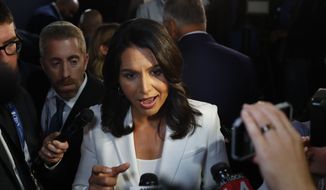 Rep. Tulsi Gabbard, Hawaii Democrat, answers questions after the second of two Democratic presidential primary debates hosted by CNN Thursday, Aug. 1, 2019, in the Fox Theatre in Detroit. (AP Photo/Paul Sancya)