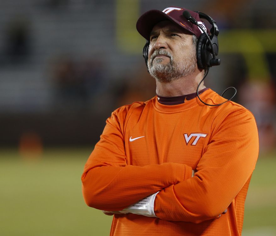 In this Oct. 25, 2018, file photo, Virginia Tech defensive coordinator Bud Foster looks at the scoreboard during the second half of an NCAA college football game against Georgia Tech, in Blacksburg, Va. Foster says the upcoming football season will be his final as an assistant coach. Foster has been the Hokies defensive coordinator since 1995. His 33 years on staff makes him the longest tenured assistant coach in the country at the same school. (AP Photo/Steve Helber, File) **FILE**