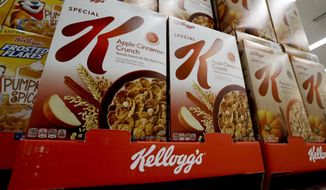 FILE- In this Aug. 8, 2018, file photo boxes of Kellogg&#39;s Special K cereal sit on display in a market in Pittsburgh. Kellogg Co. reports financial results Thursday, Aug. 1. (AP Photo/Gene J. Puskar, File)