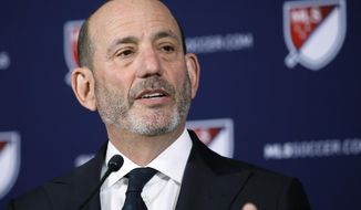 FILE - In this April 18, 2019 file photo Major League Soccer Commissioner Don Garber speaks at a news conference in Los Angeles. Garber&#39;s 20th anniversary as Major League Soccer&#39;s commissioner is Sunday, Aug. 4, 2019 and the league&#39;s challenge these days is growth and not survival, an upward trajectory that will be boosted when the U.S. co-hosts the World Cup in 2026. MLS has doubled in size to 24 teams under Garber&#39;s leadership, plays primarily in soccer specific stadiums and maintains an average attendance among the top 10 soccer leagues in the world. (AP Photo/Alex Gallardo, file)