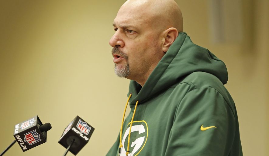 FILE - In this Feb. 18, 2019, file photo, Green Bay Packers' defensive coordinator Mike Pettine addresses the media during a press conference in Green Bay, Wis. The Packers used major assets this offseason to upgrade their defense and Pettine and others are seeing the difference.(AP Photo/Matt Ludtke, File)