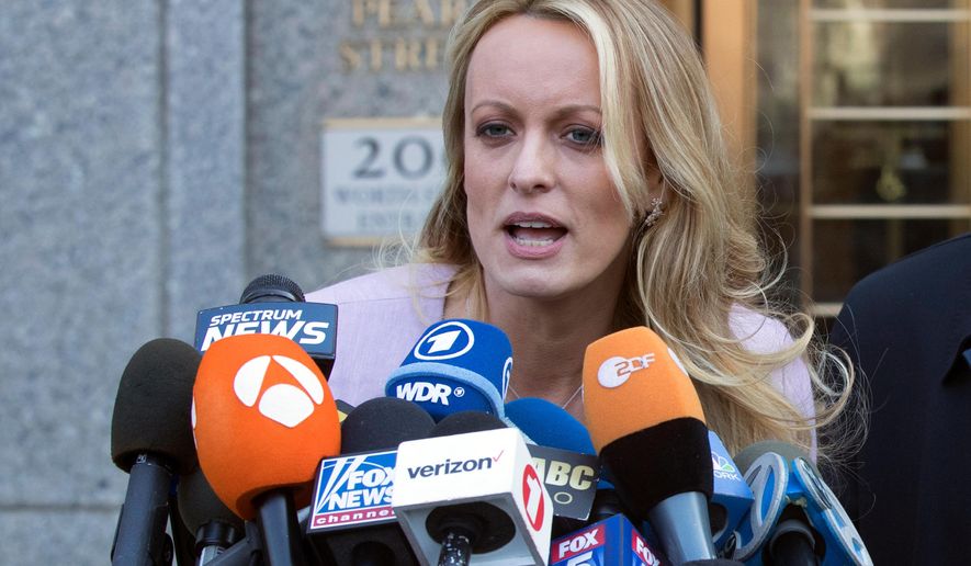 FILE - In this April 16, 2018, file photo, adult film actress Stormy Daniels speaks outside federal court in New York. Columbus police say five officers from the department's now-disbanded vice unit face discipline for the 2018 raid on a strip club that resulted in the arrest of Stormy Daniels. The department said Wednesday, July 31, 2019, that the officers could face punishment ranging from a reprimand to firing. The officers include a commander, lieutenant, sergeant and two of the arresting officers.(AP Photo/Mary Altaffer, File)