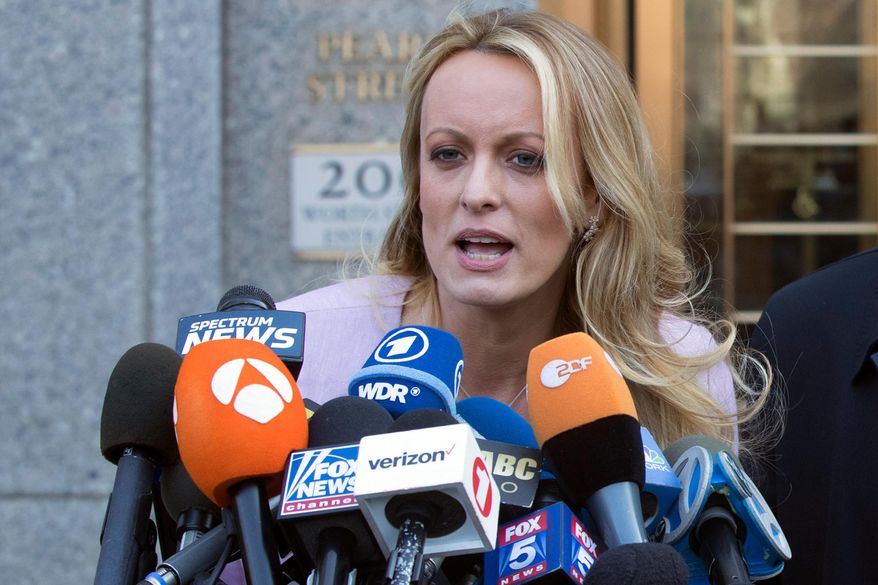 FILE - In this April 16, 2018, file photo, adult film actress Stormy Daniels speaks outside federal court in New York. Columbus police say five officers from the department's now-disbanded vice unit face discipline for the 2018 raid on a strip club that resulted in the arrest of Stormy Daniels. The department said Wednesday, July 31, 2019, that the officers could face punishment ranging from a reprimand to firing. The officers include a commander, lieutenant, sergeant and two of the arresting officers.(AP Photo/Mary Altaffer, File)