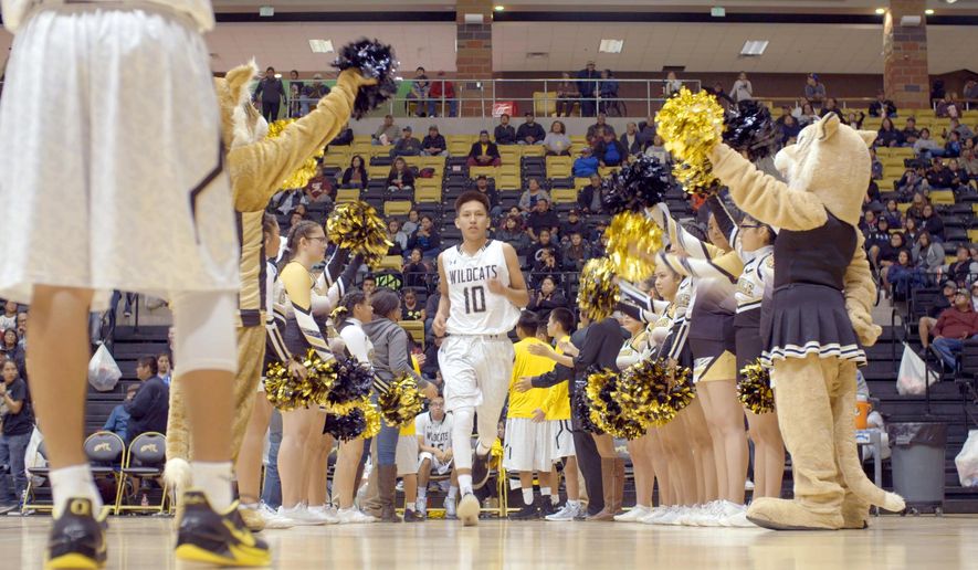 This image released by The WorkShop shows a scene from "Basketball or Nothing," a new docuseries that examines the hoops dreams of a rural, Arizona town in the heart of the Navajo Nation. The six-episode series debuts Friday on Netflix. (The WorkShop via AP)