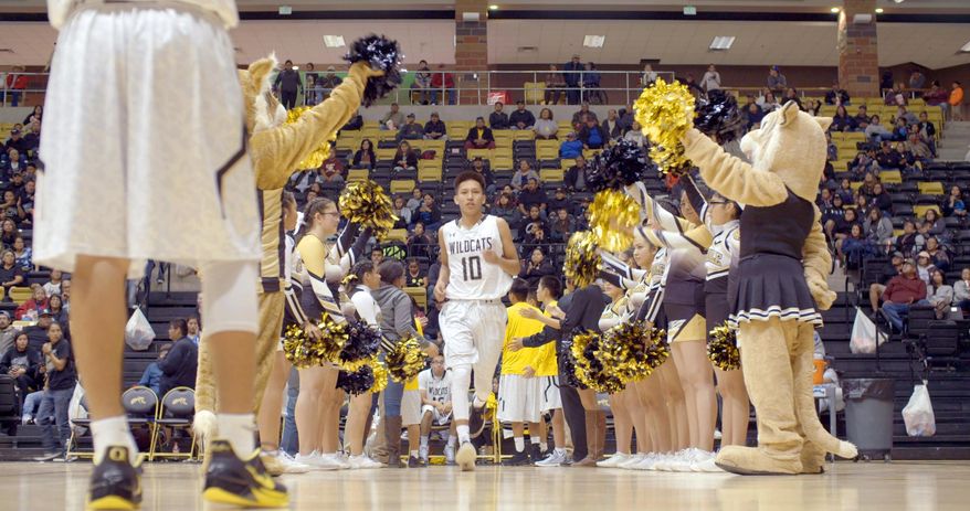 This image released by The WorkShop shows a scene from "Basketball or Nothing," a new docuseries that examines the hoops dreams of a rural, Arizona town in the heart of the Navajo Nation. The six-episode series debuts Friday on Netflix. (The WorkShop via AP)