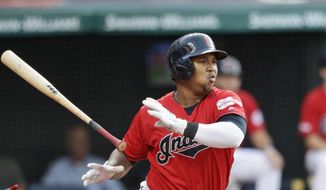 Cleveland Indians&#39; Jose Ramirez watches an RBI double during the first inning of the team&#39;s baseball game against the Los Angeles Angels, Friday, Aug. 2, 2019, in Cleveland. (AP Photo/Tony Dejak)