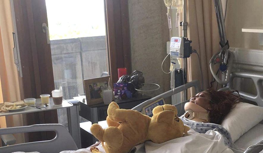 In this undated photo taken by her son, Marie Corine Bastide lays in her hospital bed at the University Hospital of Liege in Liege, Belgium. Bastide, who was involved in a car accident on the night of July 23, 2019, during one of Belgium's record breaking heat waves, survived for six days in her wrecked car in a ditch before being rescued. (Hadrien Riga via AP)