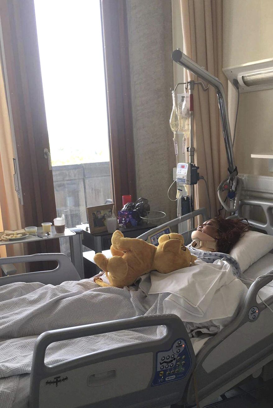 In this undated photo taken by her son, Marie Corine Bastide lays in her hospital bed at the University Hospital of Liege in Liege, Belgium. Bastide, who was involved in a car accident on the night of July 23, 2019, during one of Belgium's record breaking heat waves, survived for six days in her wrecked car in a ditch before being rescued. (Hadrien Riga via AP)