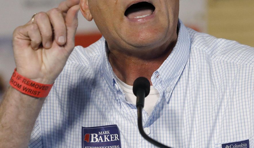 Republican Rep. Mark Baker from Brandon, campaigns for his party's nomination for Attorney General at the Neshoba County Fair in Philadelphia, Miss., Thursday, Aug. 1, 2019. (AP Photo/Rogelio V. Solis)